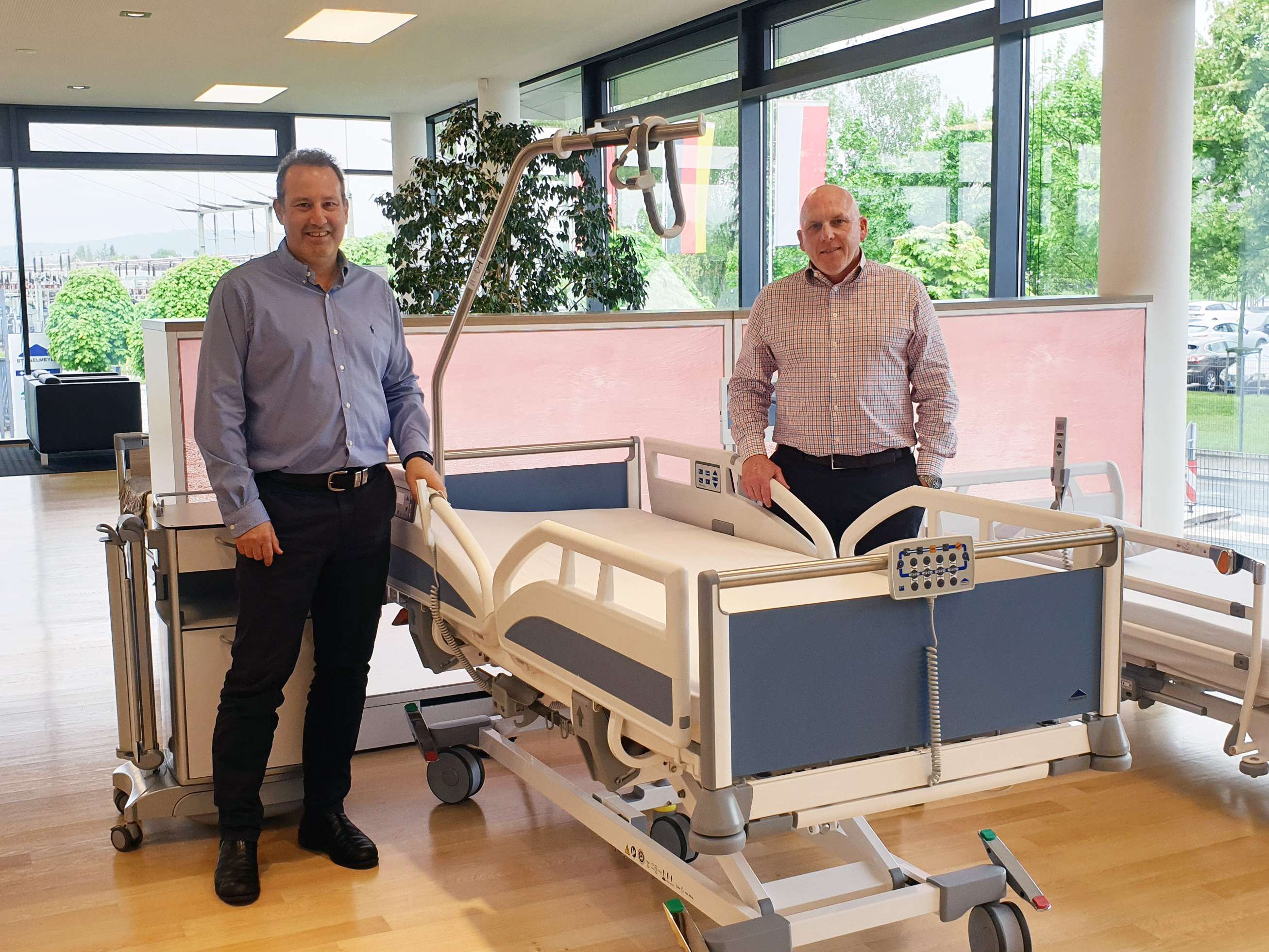 Tim Cohen and Chris Pearson from Innovate Care with the Stiegelmeyer hospital bed Evario